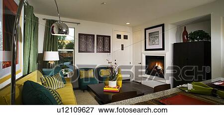 Stock Photo - Brightly Colored Living Room with Fireplace. Fotosearch