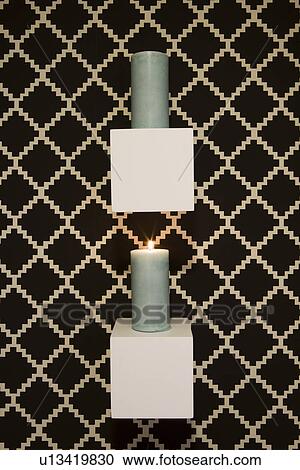 Candle display hung on wall with printed wall paper View Large Photo Image Stock Image - Candle display hung on wall with printed wall paper. Fotosearch