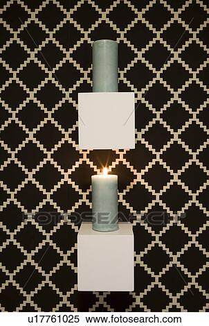 Candle display hung on wall with printed wall paper View Large Photo Image Stock Photography - Candle display hung on wall with printed wall paper. Fotosearch