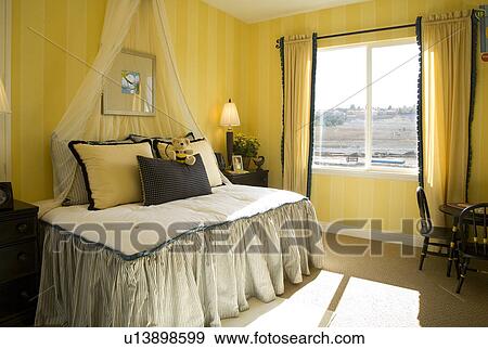 Stock Photo - Children's bedroom with yellow and black bee theme. Fotosearch