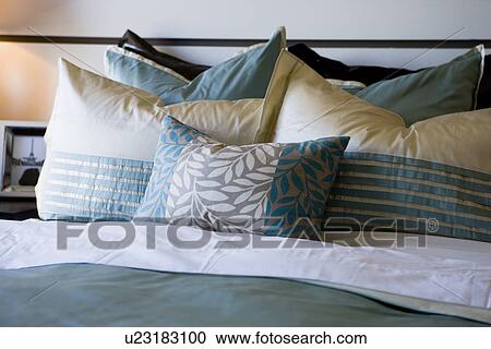 Collection of pillows on bed View Large Photo Image Stock Image - Collection of pillows on bed. Fotosearch