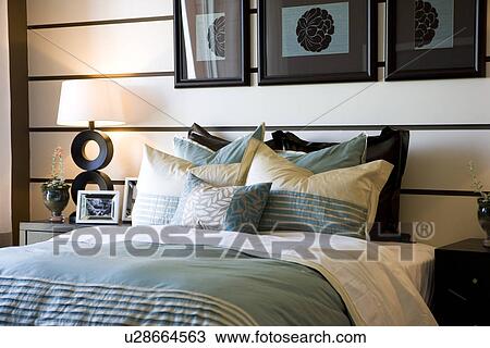 Collection of pillows on bed View Large Photo Image Stock Image - Collection of pillows on bed. Fotosearch