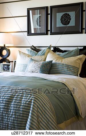 Collection of pillows on bed View Large Photo Image Stock Photo - Collection of pillows on bed. Fotosearch