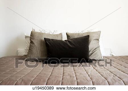 Stock Photo - Collections of pillows on Bed. Fotosearch