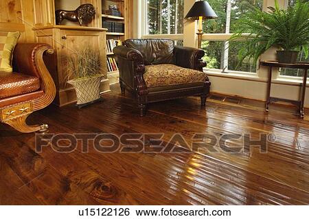 Comfy leather armchair in corner near window View Large Photo Image Stock Photograph - Comfy leather armchair in corner near window. Fotosearch