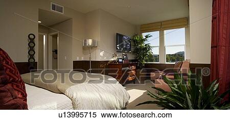 Stock Photography - Contemporary bedroom with sitting area. Fotosearch