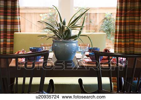 Contemporary captains chairs at table in front of window View Large Photo Image Picture - Contemporary captains chairs at table in front of window. Fotosearch