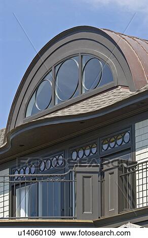 Contemporary exterior round top window and balcony View Large Photo Image Stock Photo - Contemporary exterior round top window and balcony. Fotosearch