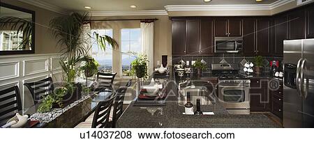 Stock Photo - Contemporary kitchen and dining area. Fotosearch