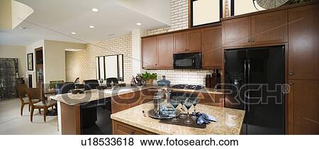 Contemporary Kitchen with Dark Wood Cabinetry View Large Photo Image Stock Photo - Contemporary Kitchen with Dark Wood Cabinetry. Fotosearch
