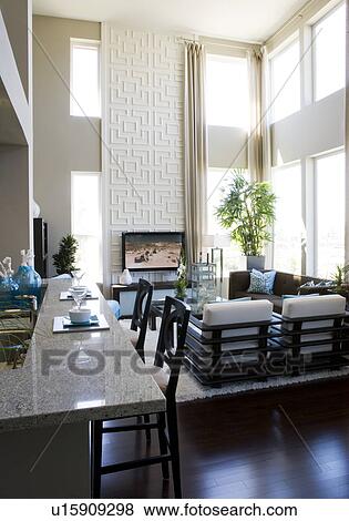 Contemporary loft interior with breakfast bar and living room View Large Photo Image Stock Photo - Contemporary loft interior with breakfast bar and living room. Fotosearch