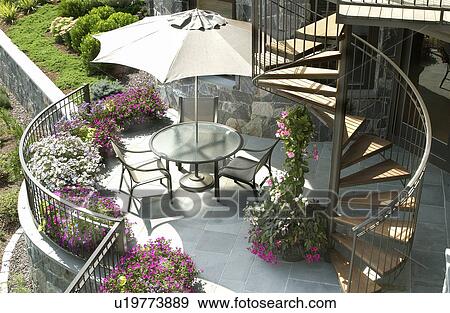 Contemporary patio with spiral staircase View Large Photo Image Stock Photo - Contemporary patio with spiral staircase. Fotosearch