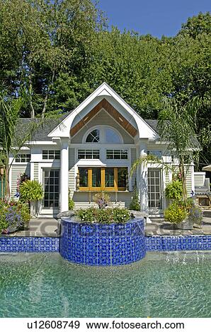 Stock Photo - Contemporary pool house and swimming pool. Fotosearch