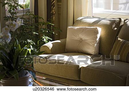 Stock Photograph - Contemporary sofa with window light. Fotosearch