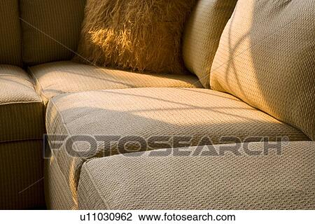 Corner of sectional sofa with furry throw pillow View Large Photo Image Stock Image - Corner of sectional sofa with furry throw pillow. Fotosearch