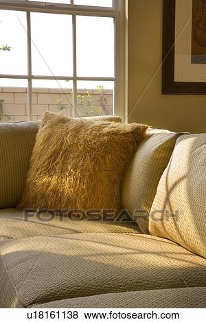 Corner of sectional sofa with furry throw pillow View Large Photo Image Stock Photo - Corner of sectional sofa with furry throw pillow. Fotosearch