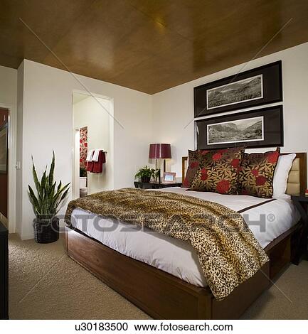 Stock Image - Cozy Bedroom with Animal Print. Fotosearch