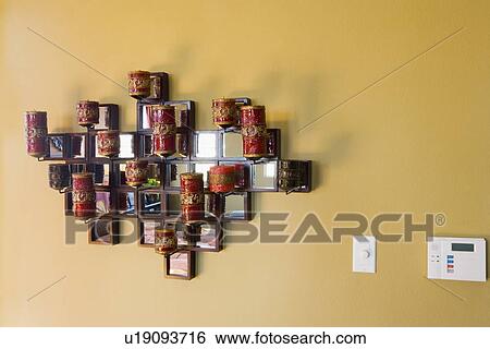Decorative candle display on wall View Large Photo Image Stock Photograph - Decorative candle display on wall. Fotosearch