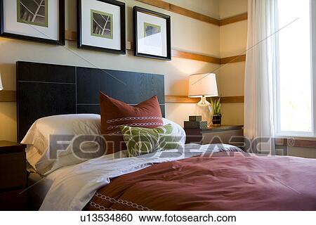 Decorative pillows on contemporary bed View Large Photo Image Stock Image - Decorative pillows on contemporary bed. Fotosearch