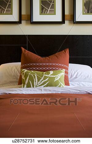 Decorative pillows on contemporary bed View Large Photo Image Stock Image - Decorative pillows on contemporary bed. Fotosearch