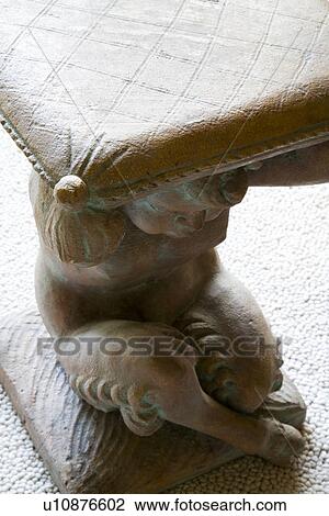 Stock Image - Detail centaur supporting stone table. Fotosearch