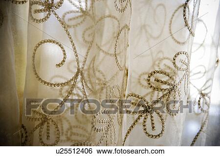 Stock Photograph - Detail embroidered sheer curtains. Fotosearch