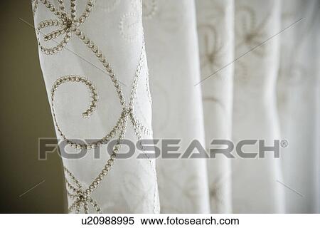 Stock Photography - Detail embroidered sheer curtains. Fotosearch