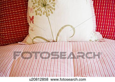 Detail of bedspread and decorative pillows on bed View Large Photo Image Stock Photo - Detail of bedspread and decorative pillows on bed. Fotosearch