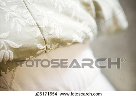 Picture - Detail of embroidered bed spread. Fotosearch