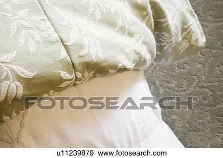Stock Photo - Detail of embroidered bed spread. Fotosearch