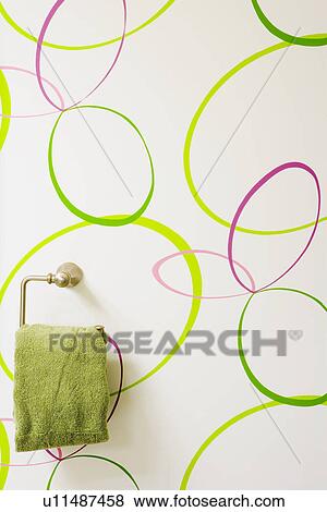 Detail of hand towel hanging on bright bathroom wall View Large Photo Image Stock Photo - Detail of hand towel hanging on bright bathroom wall. Fotosearch
