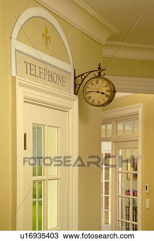 Detail of home phone room with wall clock View Large Photo Image Stock Image - Detail of home phone room with wall clock. Fotosearch