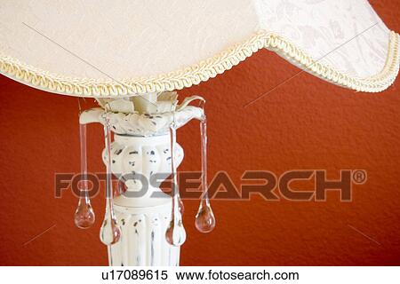 Detail of lamp with glass tear drops in front of red wall View Large Photo Image Stock Photography - Detail of lamp with glass tear drops in front of red wall. Fotosearch