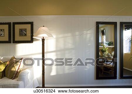 Picture - Detail of living room with wainscoting and floor lamp. Fotosearch