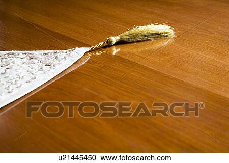 Detail of table runner with tassel on table View Large Photo Image Stock Image - Detail of table runner with tassel on table. Fotosearch