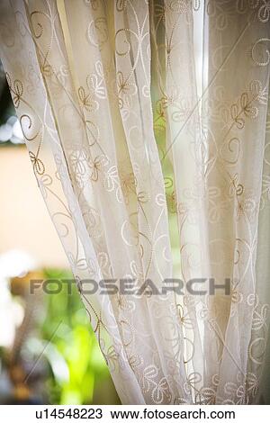 Stock Image - Detail sheer drapes with embroidery. Fotosearch