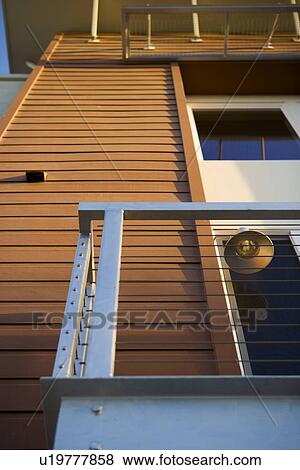 Stock Photo - Detail small balcony off contemporary loft style condo. Fotosearch