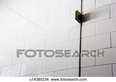 Detail tile wall with bracket holding glass shower wall View Large Photo Image Picture - Detail tile wall with bracket holding glass shower wall. Fotosearch