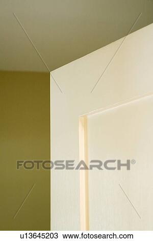Stock Image - Detail top of white door. Fotosearch