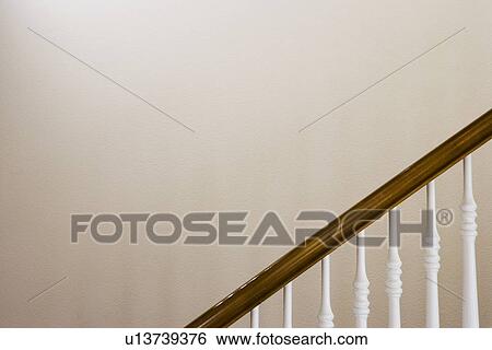 Detail traditional staircase railing in front of wall View Large Photo Image Stock Photograph - Detail traditional staircase railing in front of wall. Fotosearch