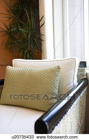 Detail wicker armchair in front of window View Large Photo Image Stock Image - Detail wicker armchair in front of window. Fotosearch