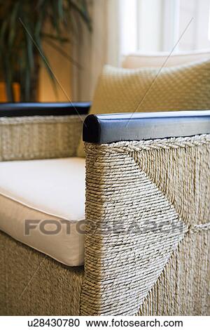 Detail wicker armchair in front of window View Large Photo Image Stock Image - Detail wicker armchair in front of window. Fotosearch