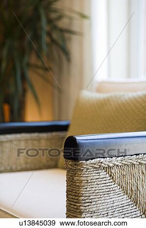 Detail wicker armchair in front of window View Large Photo Image Stock Photo - Detail wicker armchair in front of window. Fotosearch