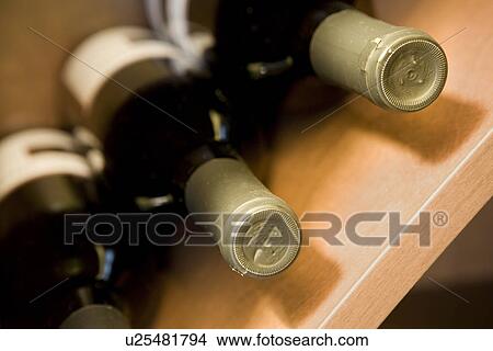Picture - Detail wine bottles in storage. Fotosearch