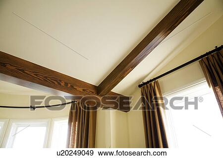 Detail Wooden Ceiling Beams And Curtain Rods Stock Photo