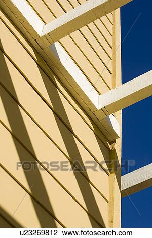 Detail yellow home with white trellis View Large Photo Image Stock Image - Detail yellow home with white trellis. Fotosearch