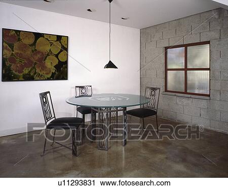 Dining table and chairs in industrial interior View Large Photo Image Stock Image - Dining table and chairs in industrial interior. Fotosearch