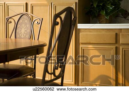Stock Image - Dining table and chairs in kitchen. Fotosearch