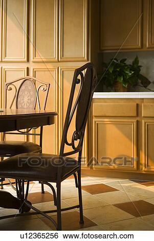 Stock Photograph - Dining table and chairs in kitchen. Fotosearch