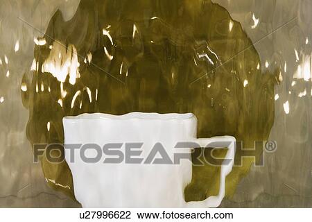 Distorted mug and plate viewed through glass View Large Photo Image Stock Image - Distorted mug and plate viewed through glass. Fotosearch